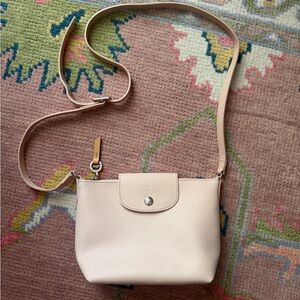 Longchamp
Le Pliage City Coated
Canvas Crossbody Bag Light Pink